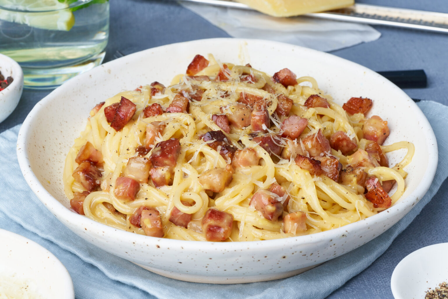 Carbonara pasta. Spaghetti with pancetta, egg, parmesan cheese and cream sauce. Traditional italian cuisine. Side view.