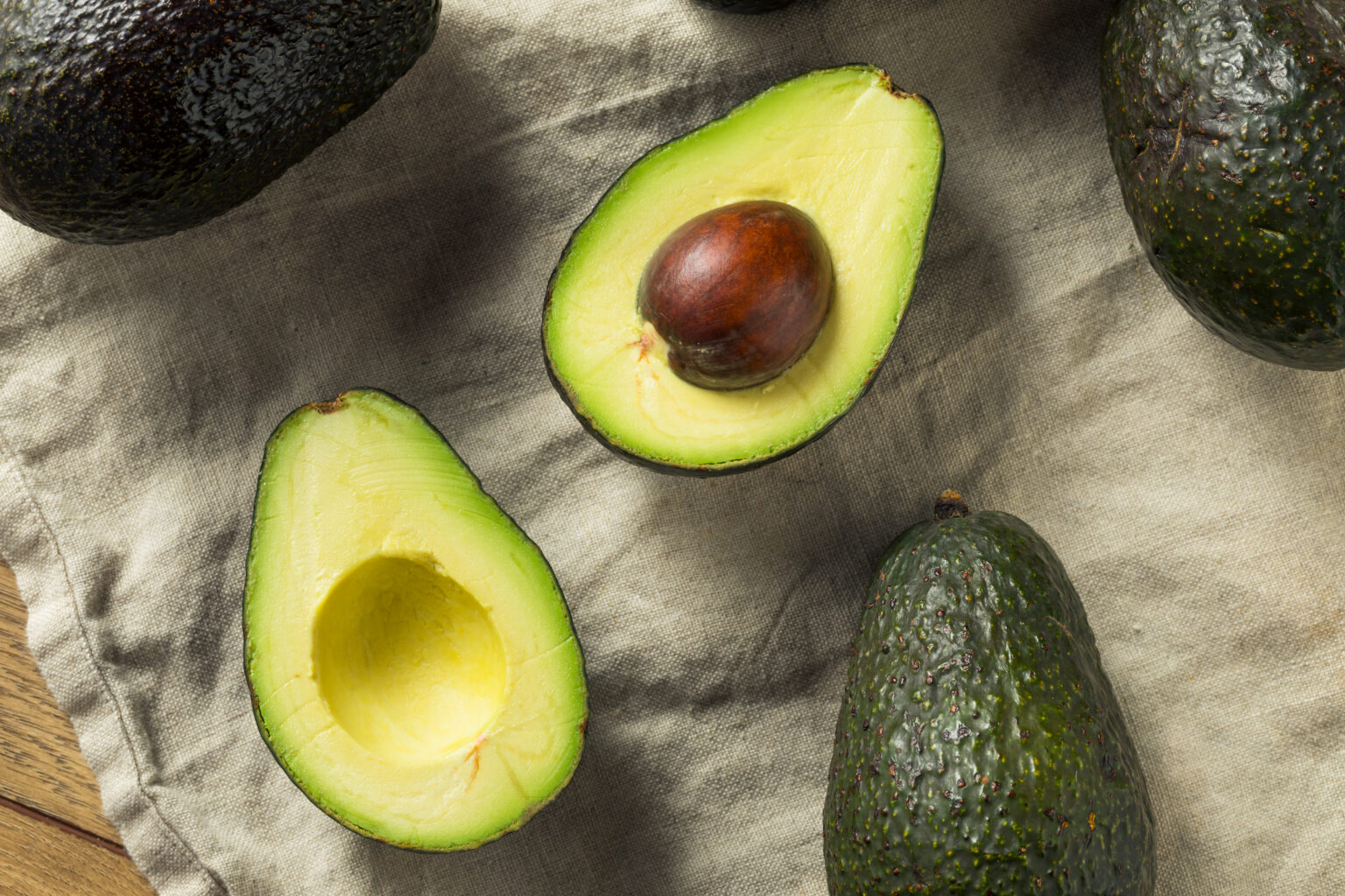 Raw Organic Green Avocados Ready to Cut Open