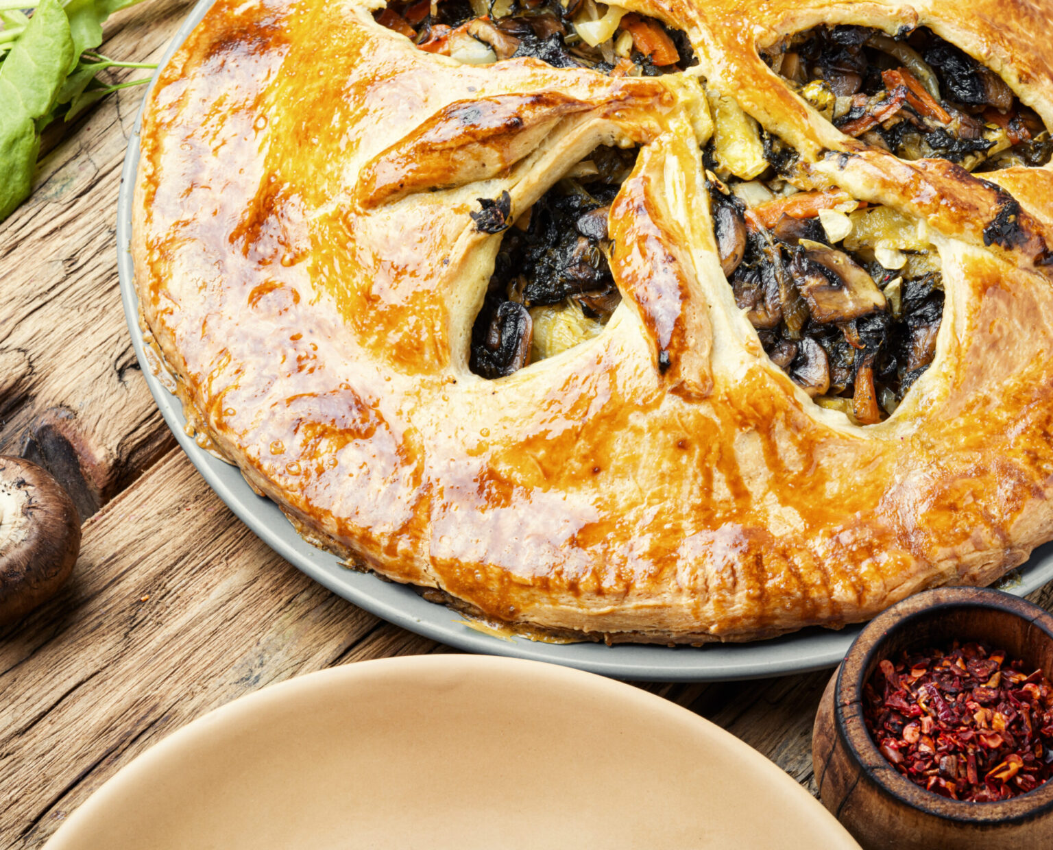 Autumn pie with mushrooms and spinach.Rustic vegetable pie.Homemade cakes