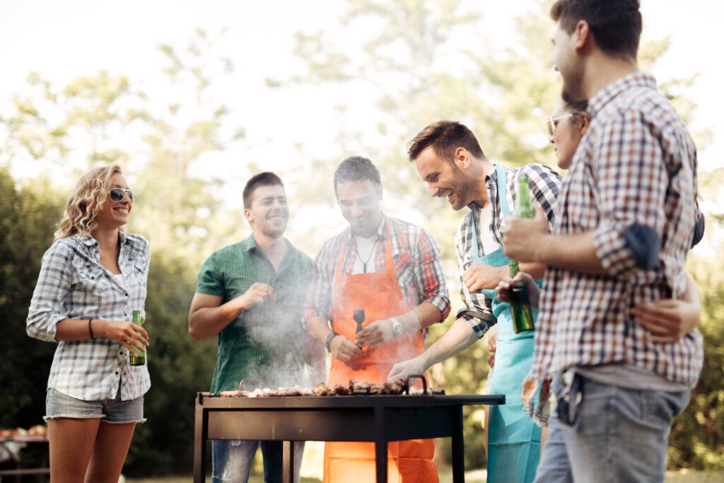 Friends camping and having a barbecue